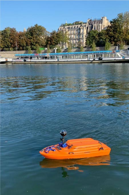 Small orange boat on water